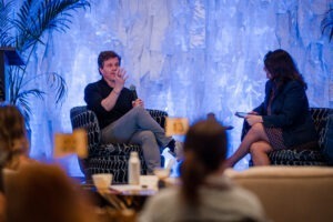 Eudemonia founder Sean Hoess on stage at Smart Meetings Wellness Experience