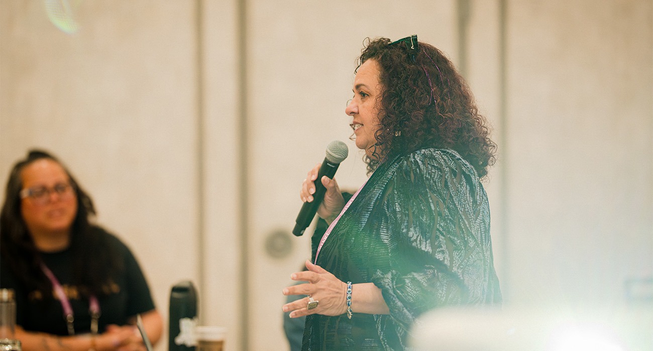 Woman speaking into microphone