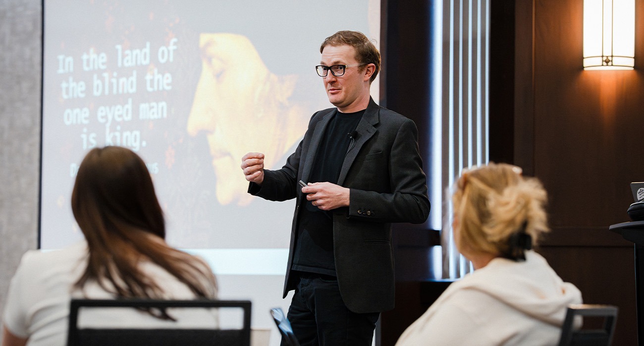Man speaking in front of people