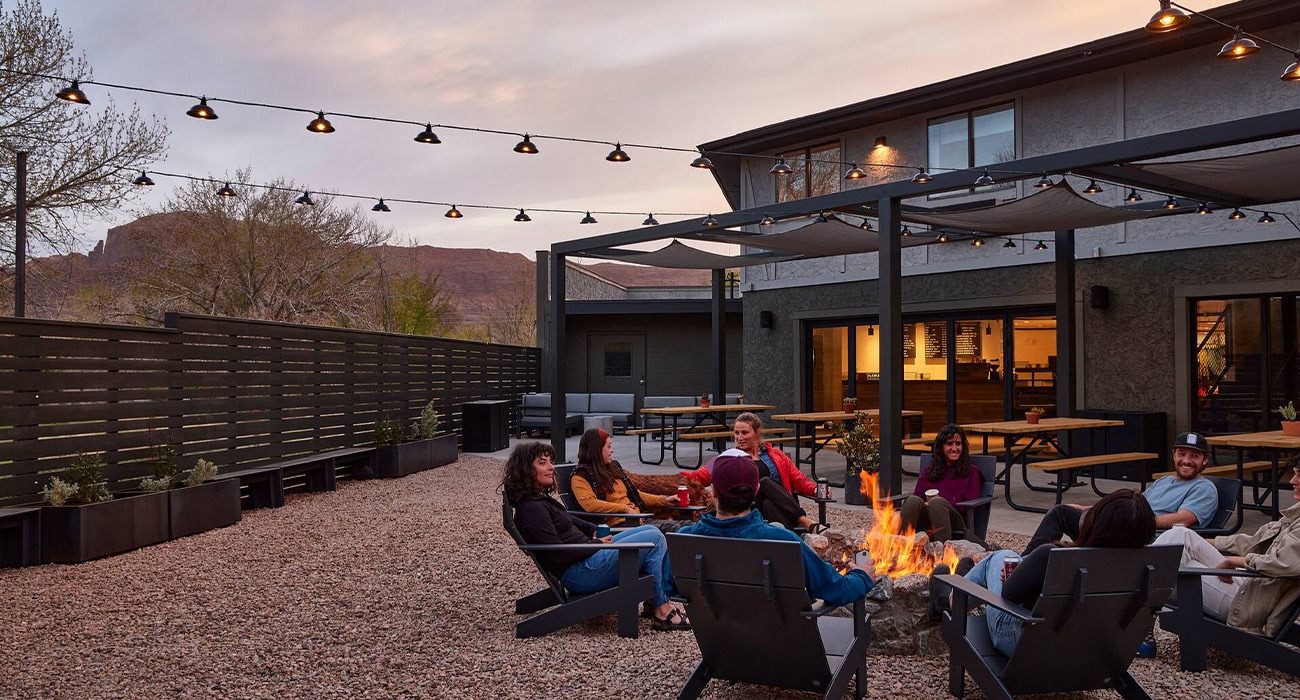 People sitting around campfire