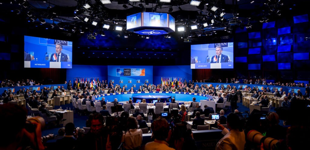 People sitting around table at NATO