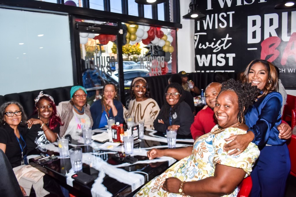 People sitting and standing in restaurant