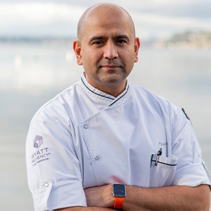 Chef Azad crossing his arms