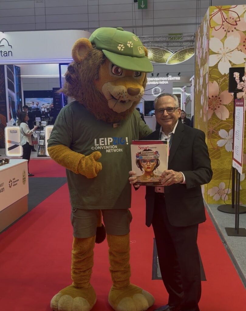 Smart Meetings Business Development Manager Jeff Posner posing with mascot