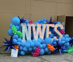 Northwest Event Show sign with balloons