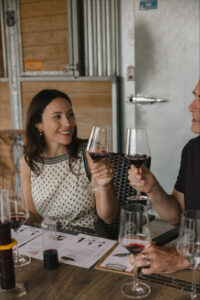 Woman with glass of wine in hand