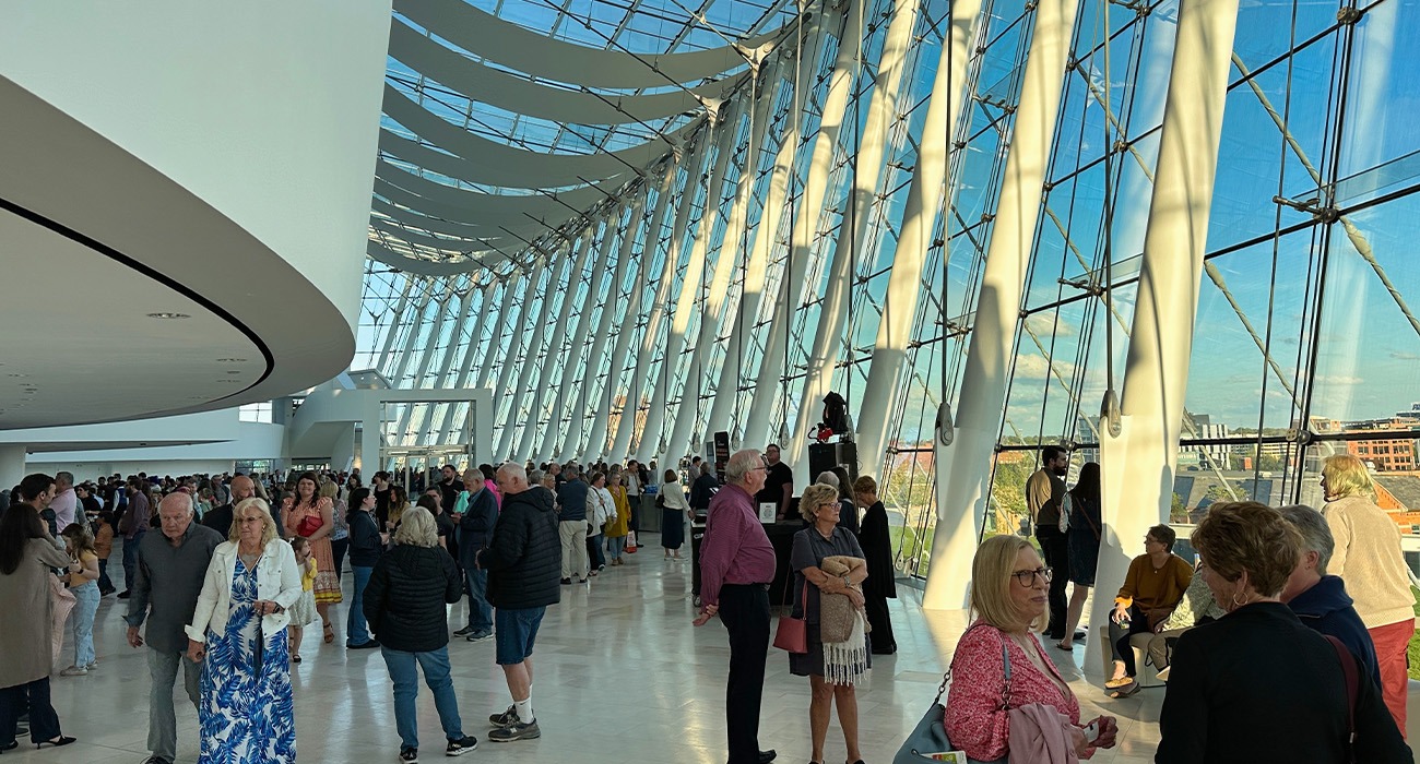 People walking around Kauffman Center for the Performing Arts