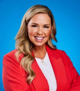 Angie Smith in orange sport coat