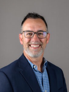 Erick Rheam in blue sport coat