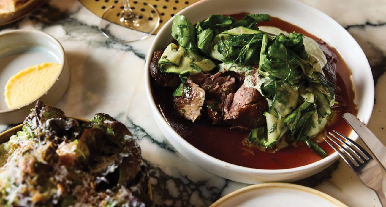 Bowl of soup and meat at Grana