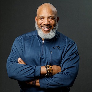 John Register in blue long sleeve shirt