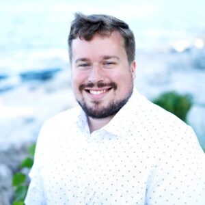 Matthew Gayer in white button up shirt