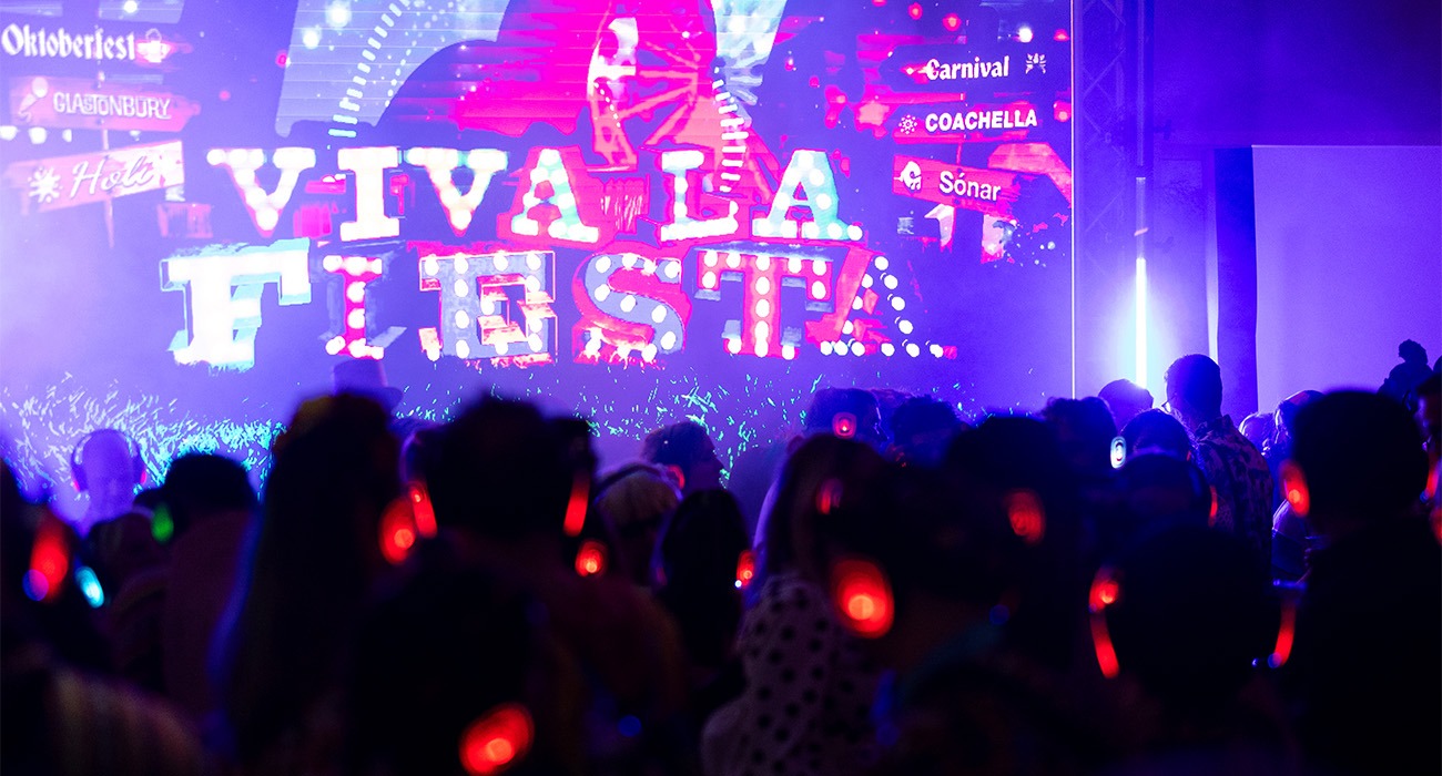 People dancing with red headphones