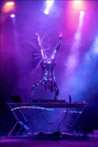 Man DJing while doing a handstand