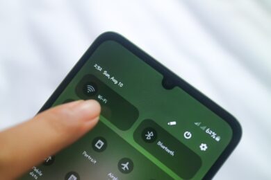 Person turning on WiFi on phone