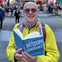 Alan Gregerman holding book in hands profile photo