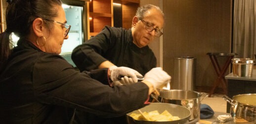 Man and woman cooking during Italian cooking class