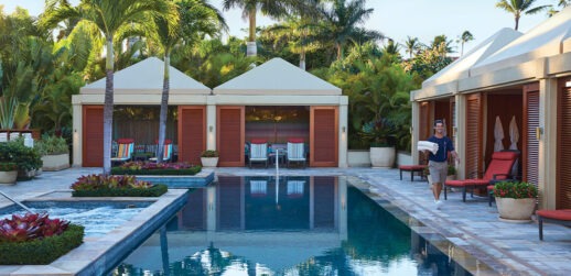 Man walking near pool at Four Seasons Resort Maui at Wailea