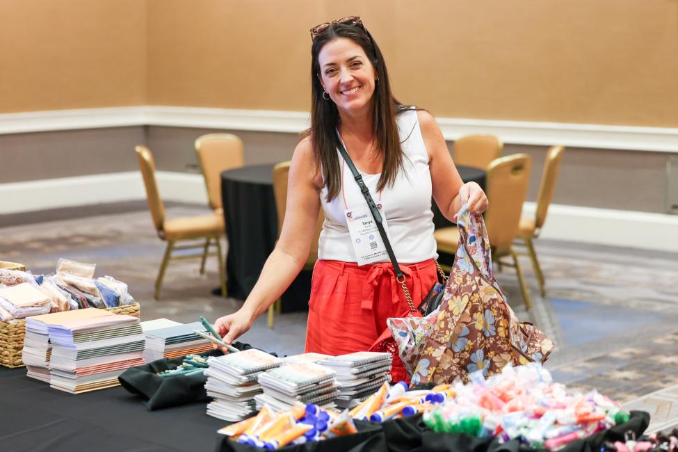 Woman standing behind give back activation on table