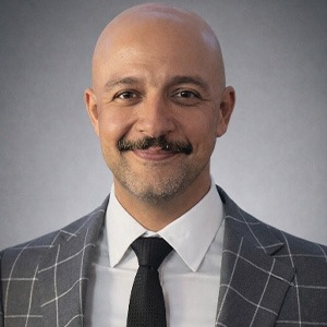 Mo halawani wearing grey sport coat