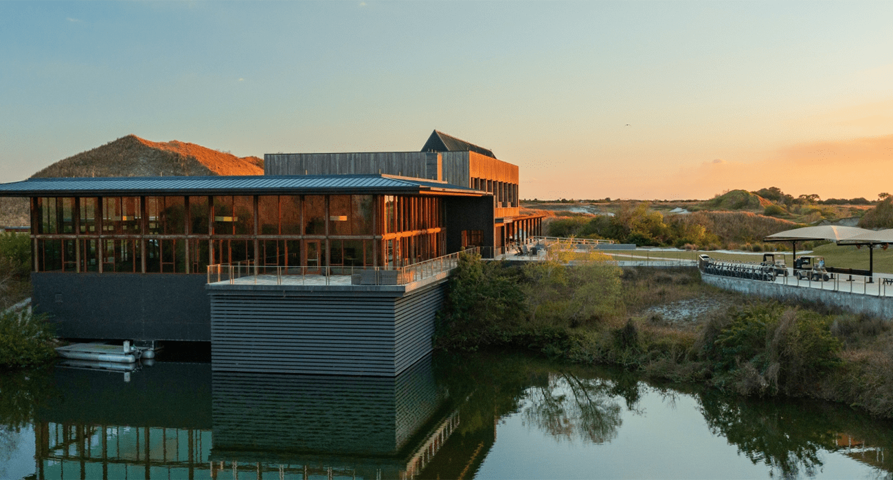 External shot of building next to body of water
