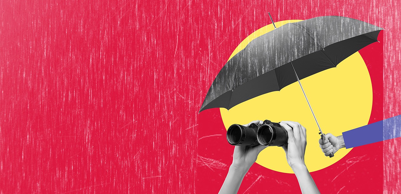 umbrella and binoculars under rain on red background