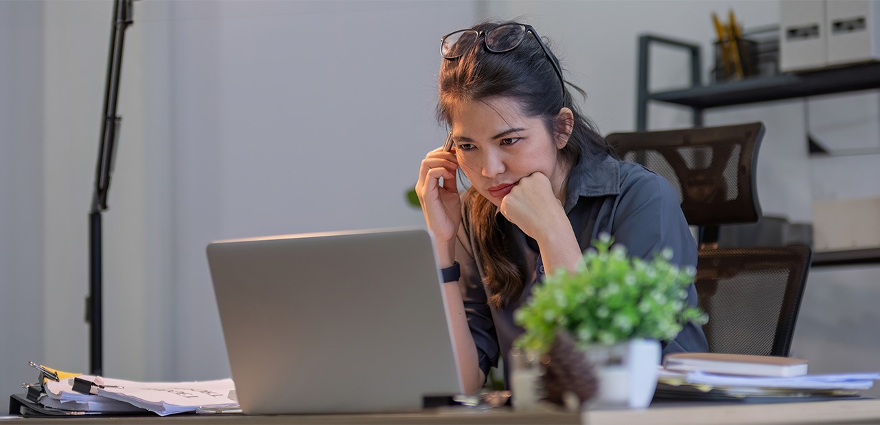 woman staring at laptop