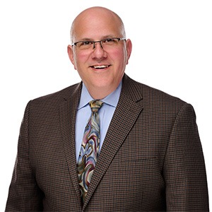 Man in brown suit