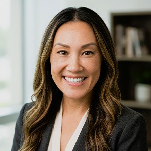 Woman wearing black sport coat and white shirt