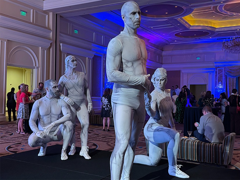 People posing as statues