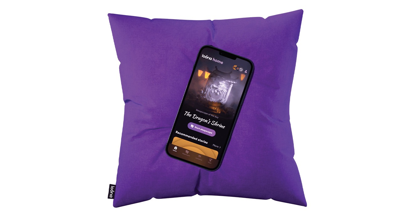 Phone sitting on purple pillow
