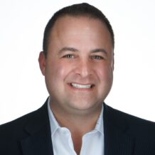 Man with black sport coat and white dress shirt profile photo