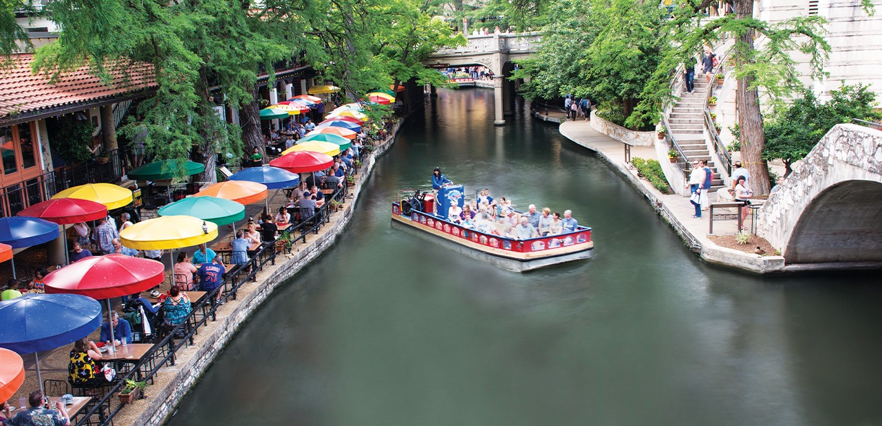 People on boat at San Antonio River Walk