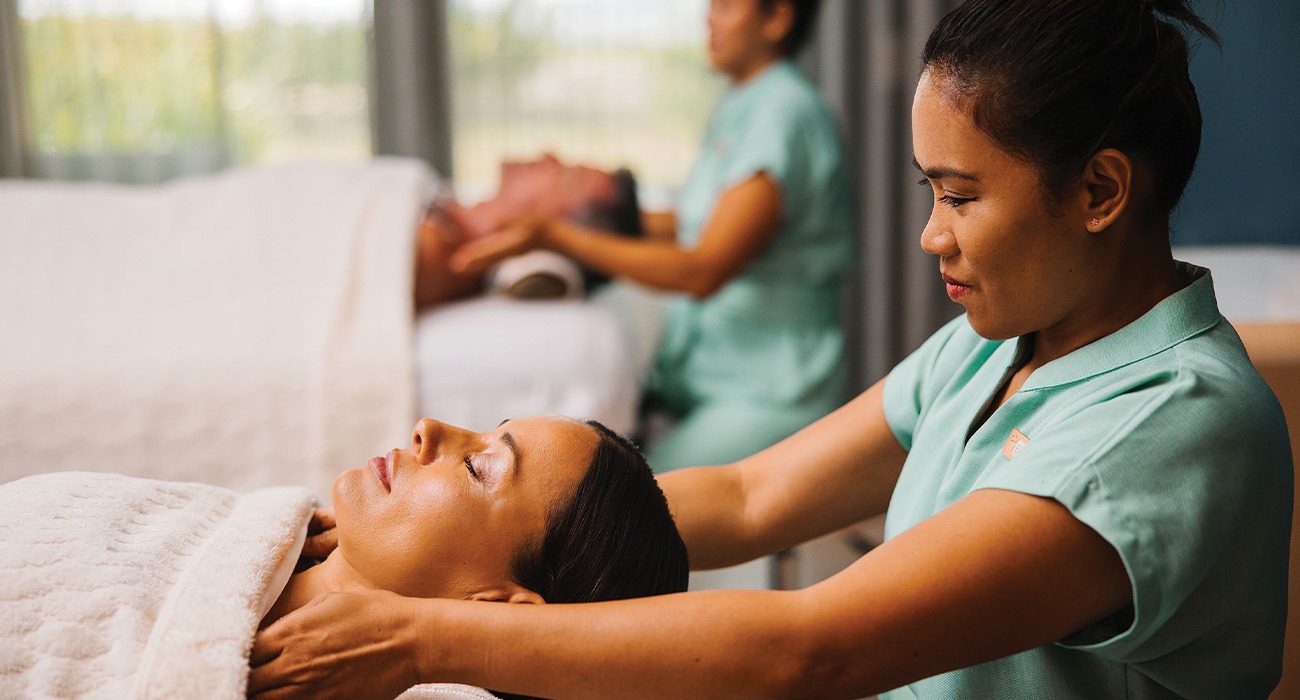 Woman giving another woman a massage treatment at The Spa at Peter Island