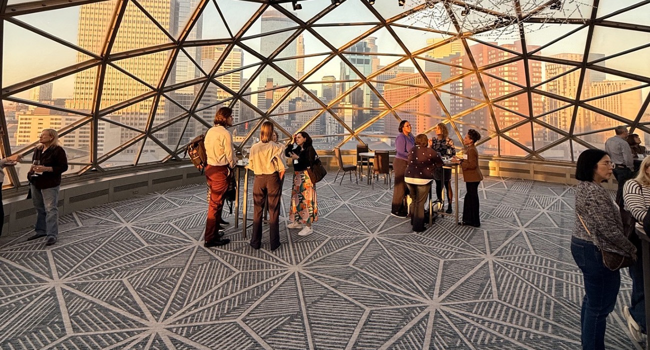 People standing and talking in indoor space