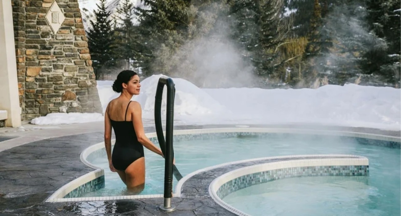 Woman entering pool