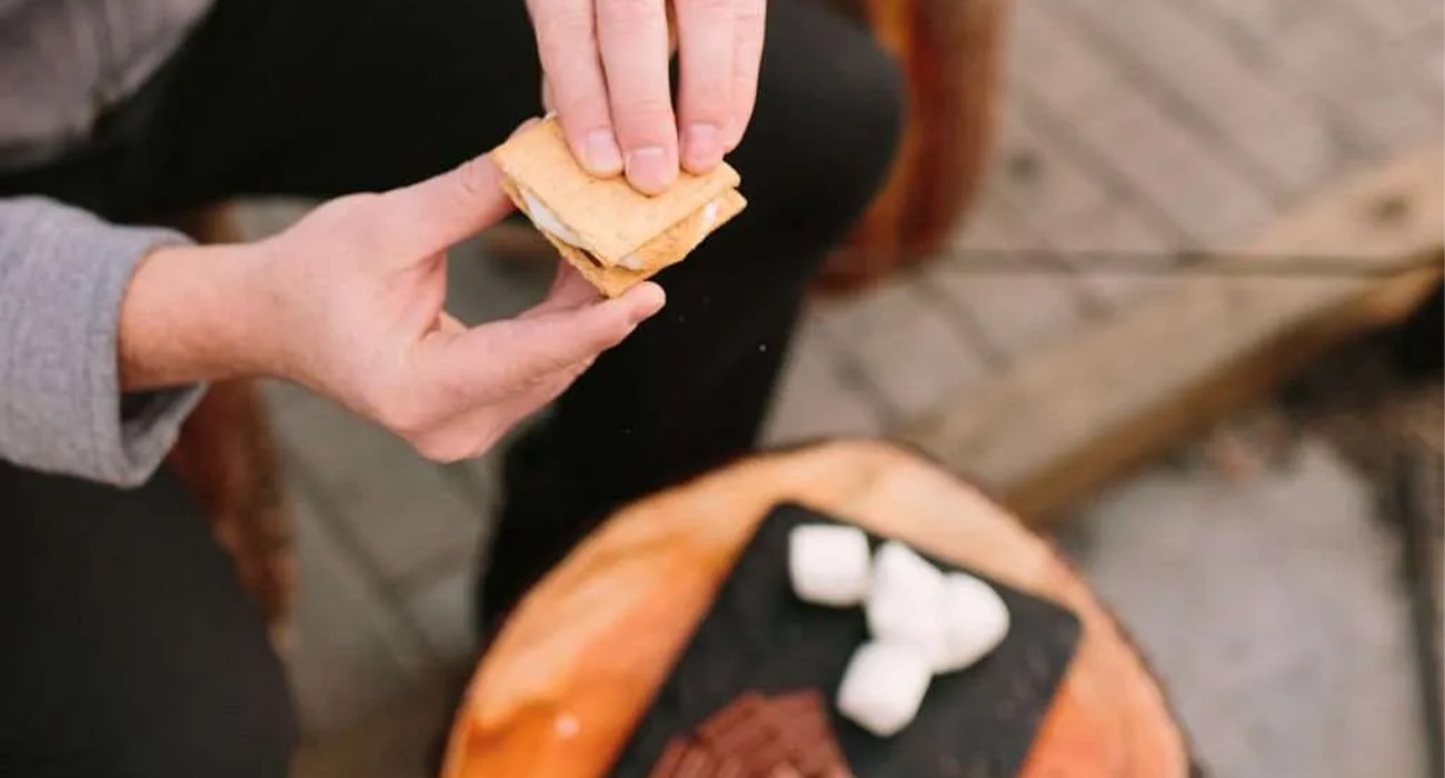 Person making s'more