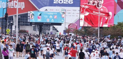 Crowd of people walking near stadium