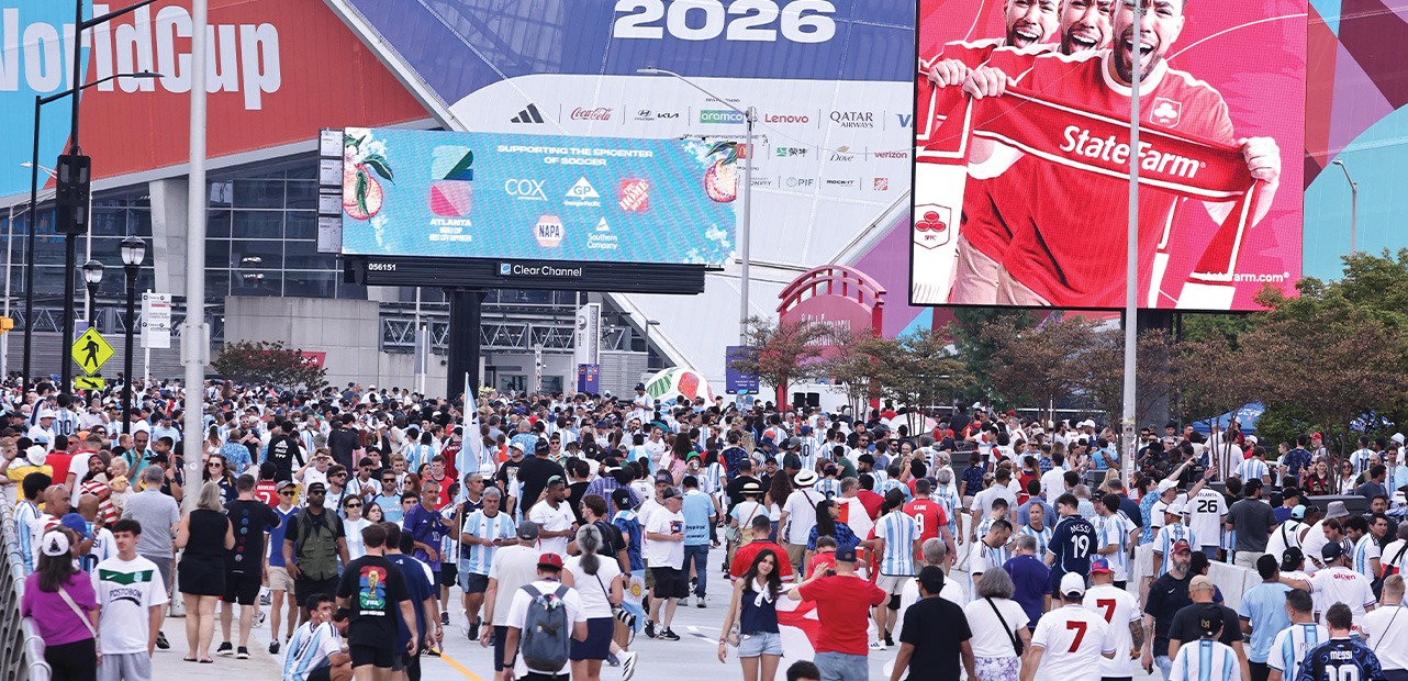 Crowd of people walking near stadium